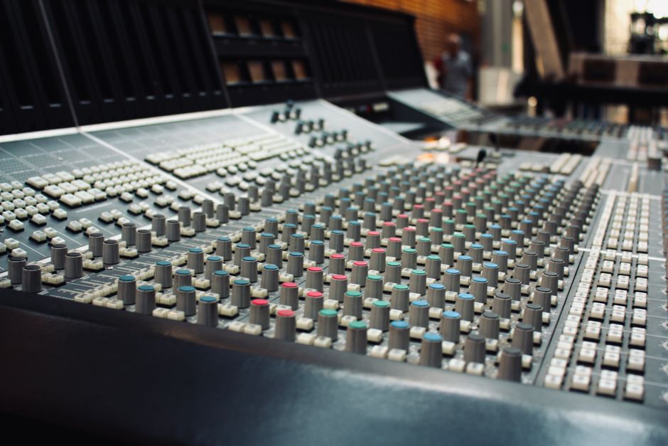 Close-up of a professional audio mixing console in a recording studio in Ciudad de México, Mexico.